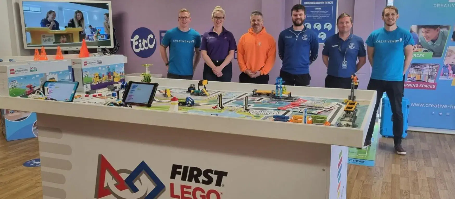 Group of educators showcasing the FIRST LEGO program at the EFDN conference in Liverpool.