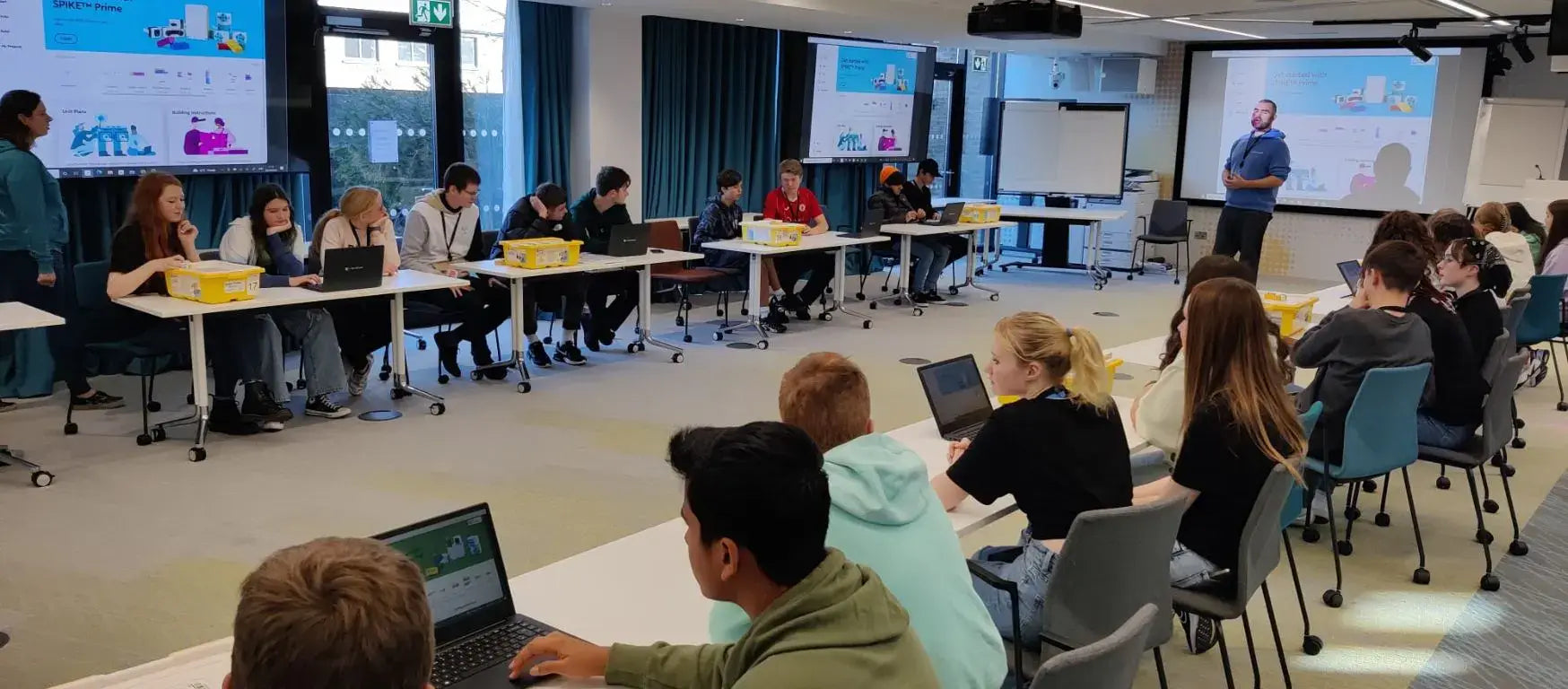 Students participating in a Creative Hut workshop at Google's Dublin office, engaging with robotics and technology.