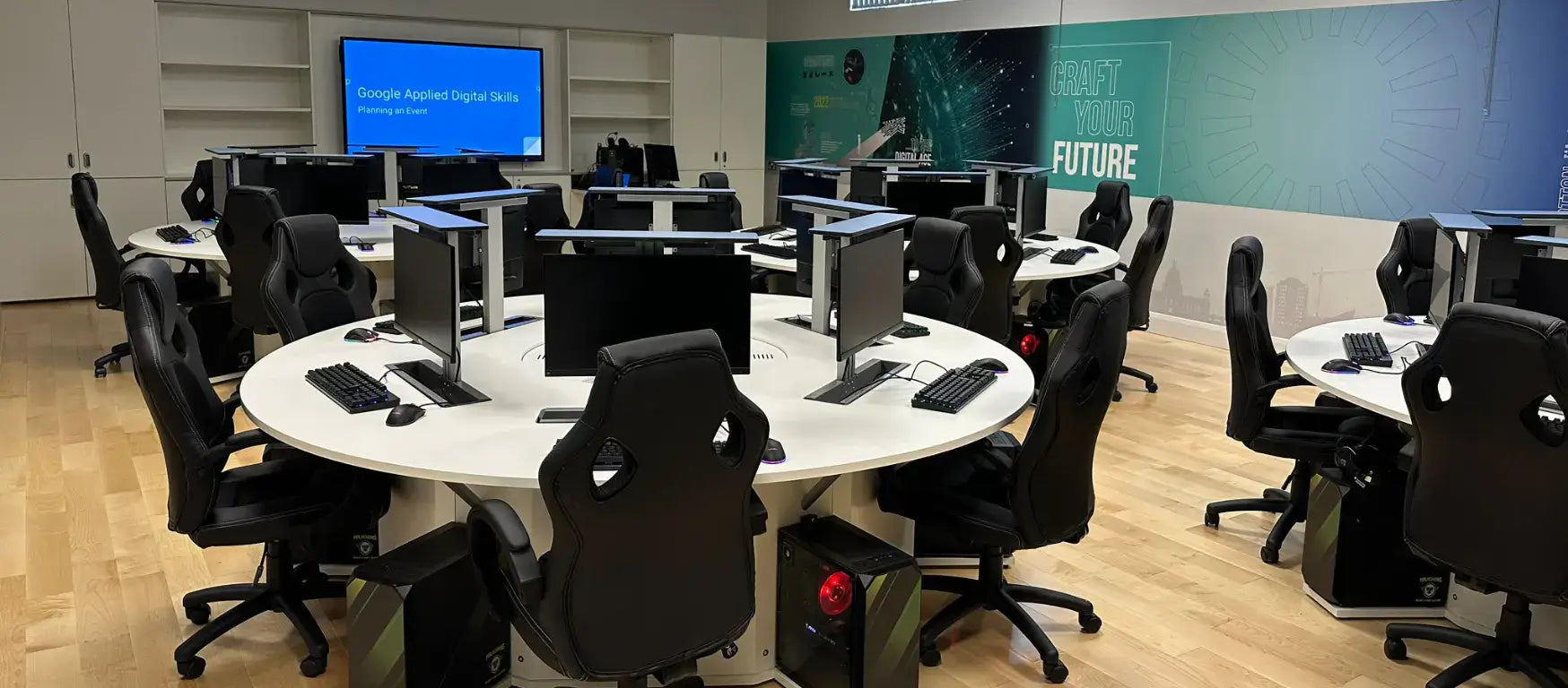 Modern esports lab with multiple computer stations and ergonomic chairs at St Malachy's College.