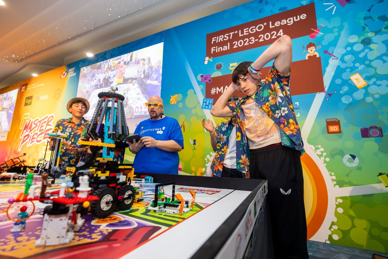 Participants at the FIRST LEGO League Final 2023-2024 showcasing their robot design and teamwork.