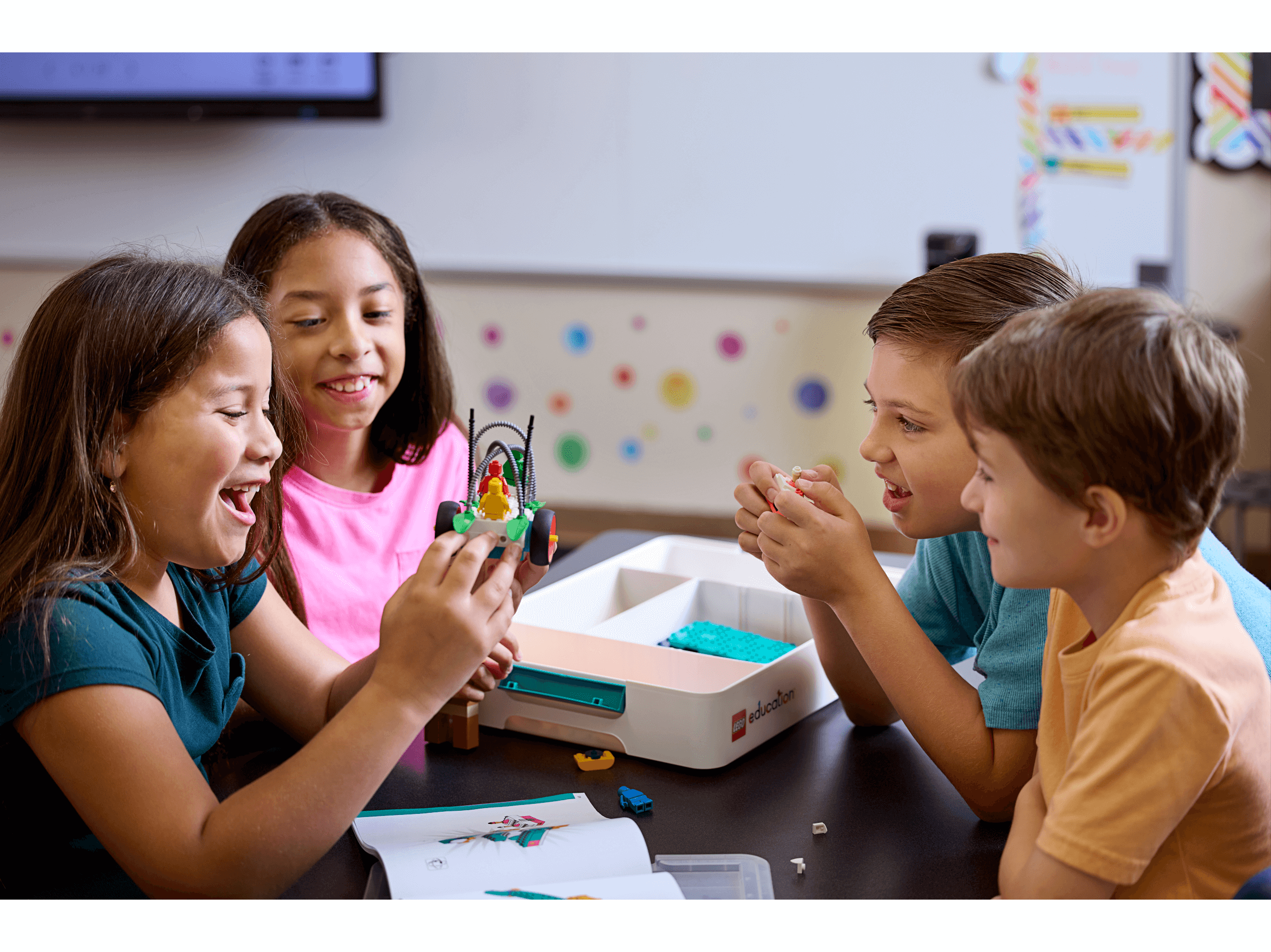 Children engaging with LEGO® Education Science kits, fostering collaboration and hands-on learning in the classroom.