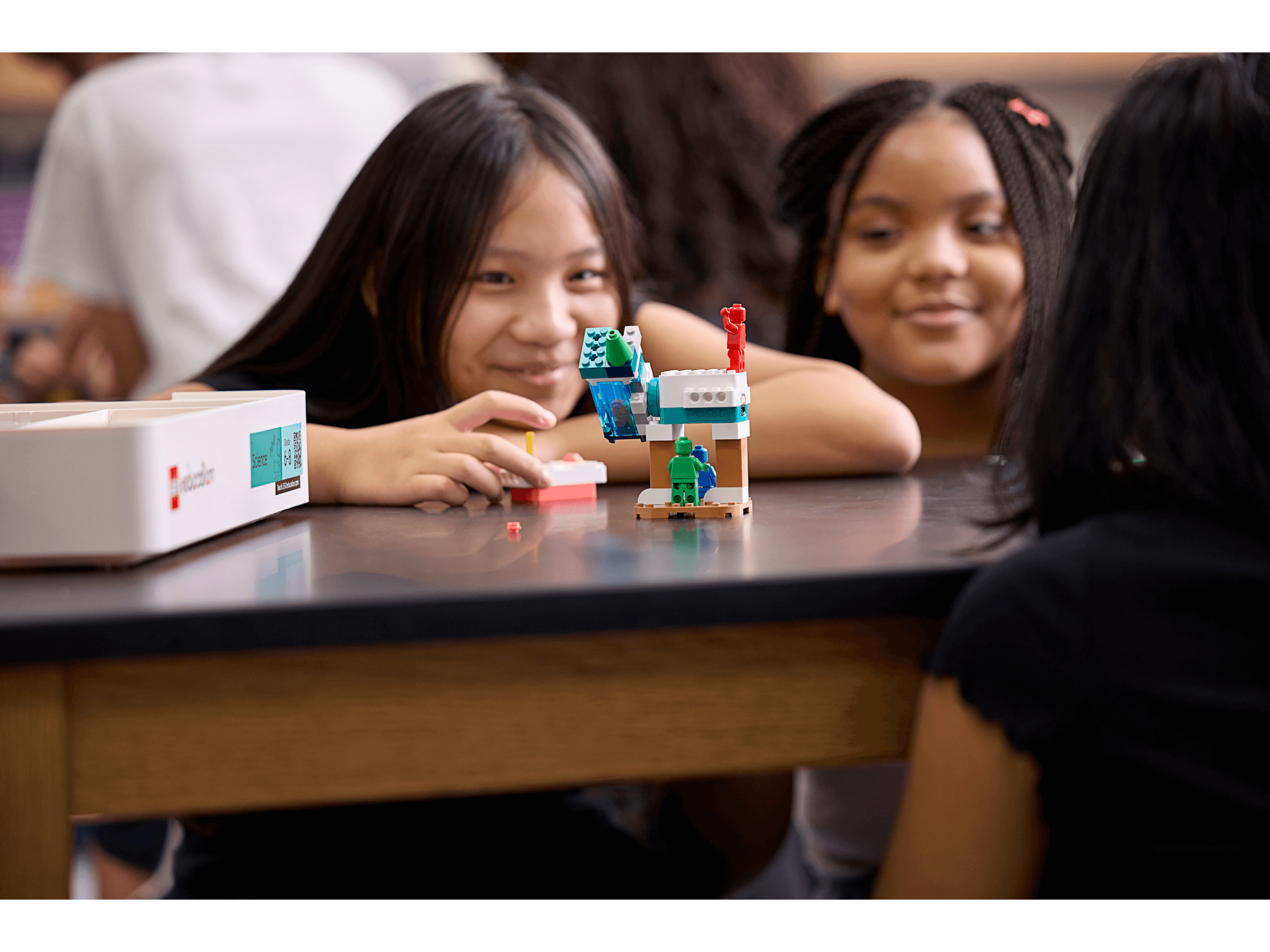 Students engaging with LEGO® Education Science kits, fostering hands-on learning and collaboration in the classroom.