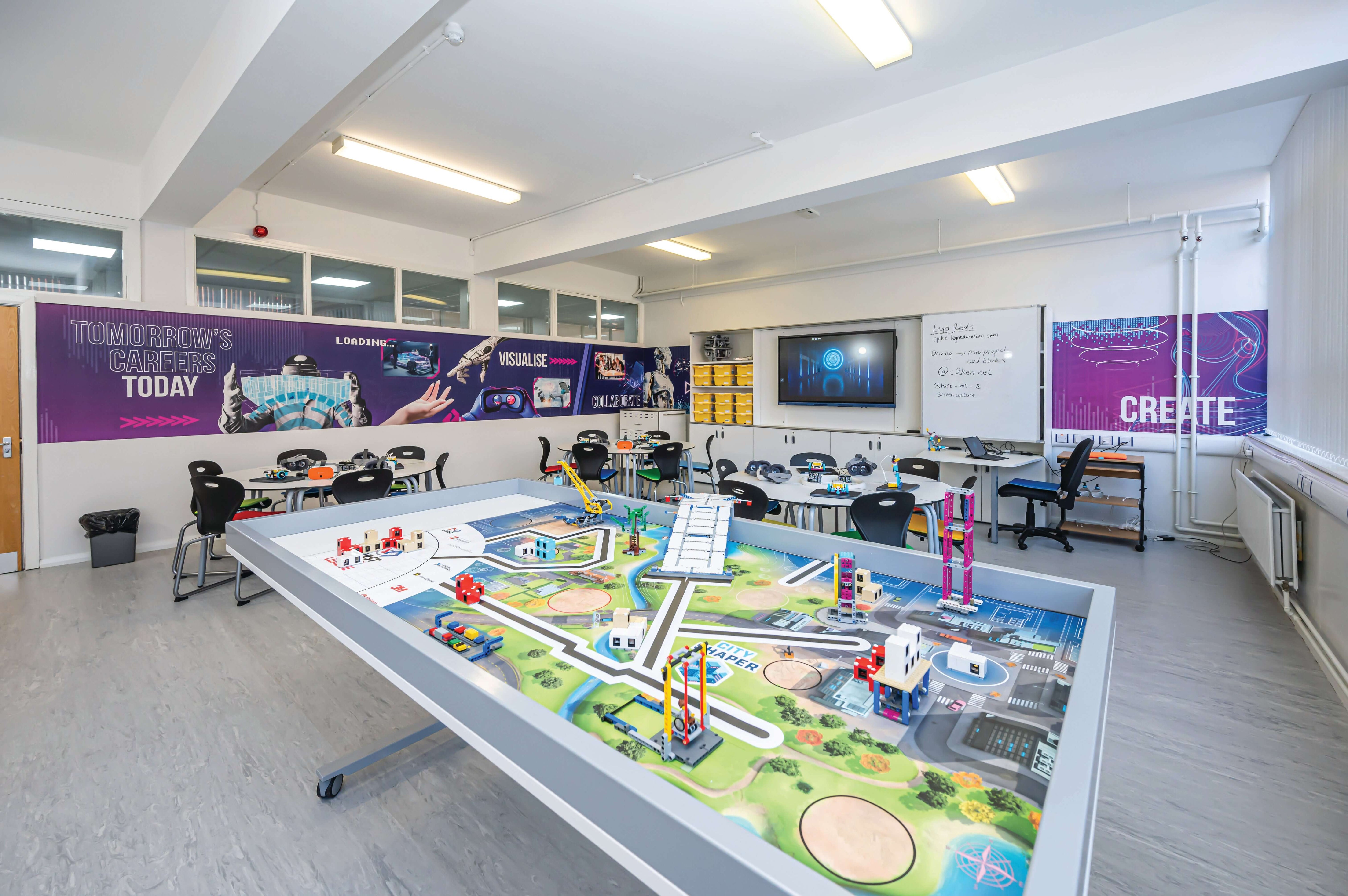 Modern classroom with a creative learning space featuring a colorful activity table and interactive technology.