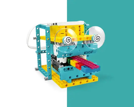 Colorful robotic toy built from construction blocks with eyes and a playful design.