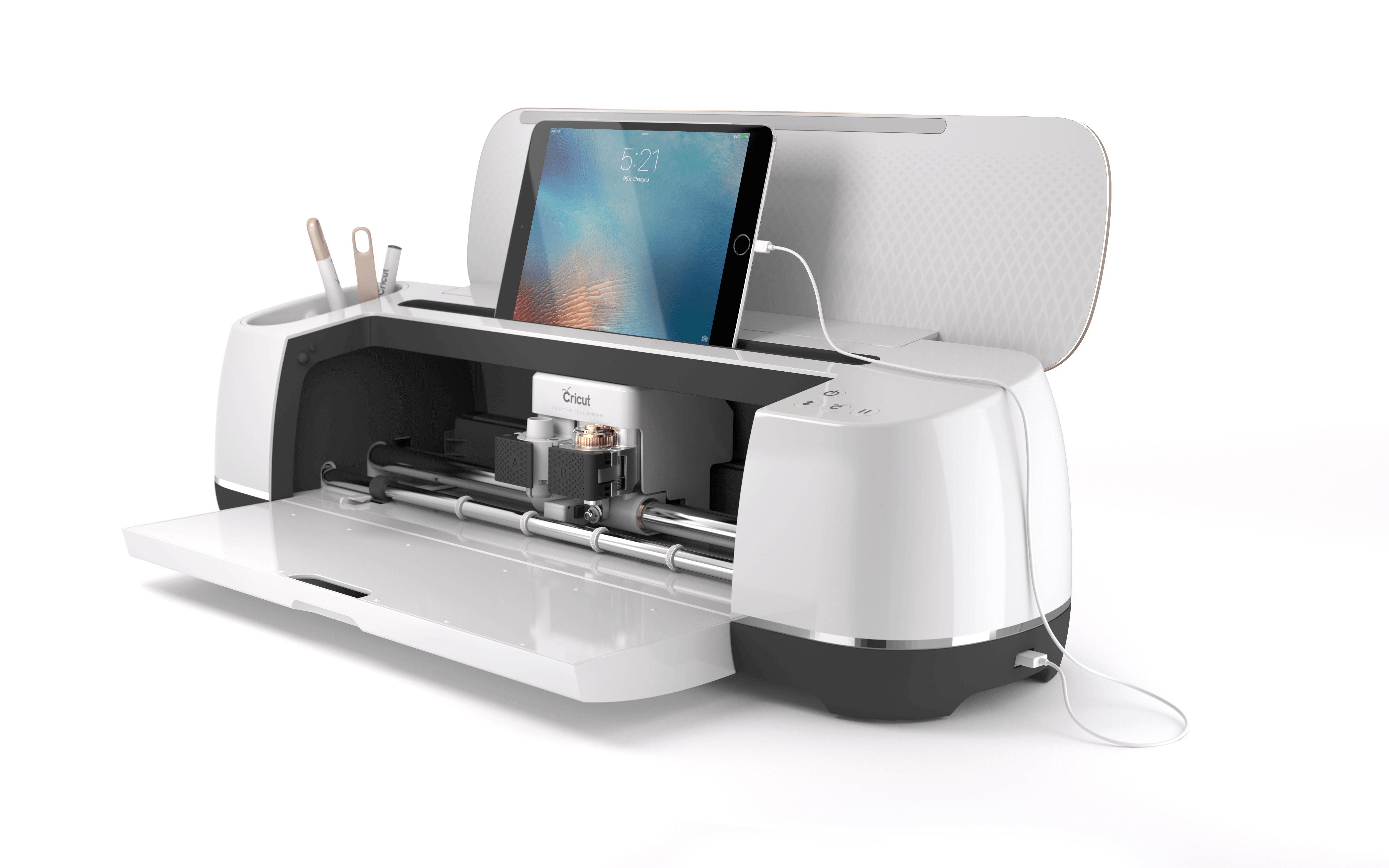 Cricut Maker® in Champagne color with tablet and tools, designed for cutting various materials for DIY projects.