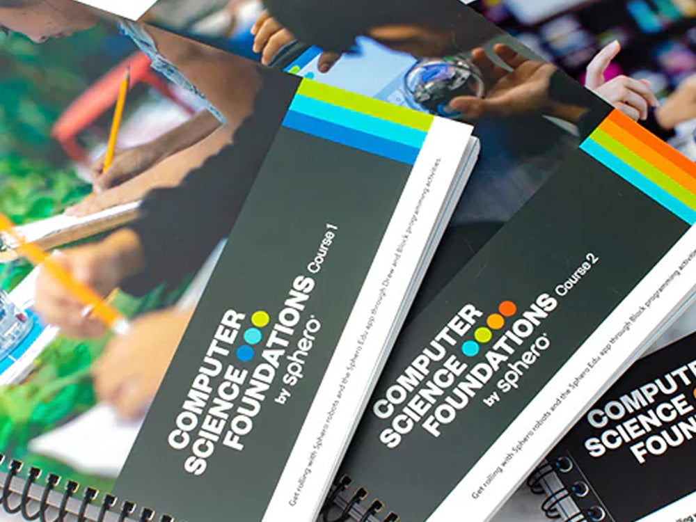 Three colorful Computer Science Foundations course books from Sphero, showcasing hands-on learning materials.