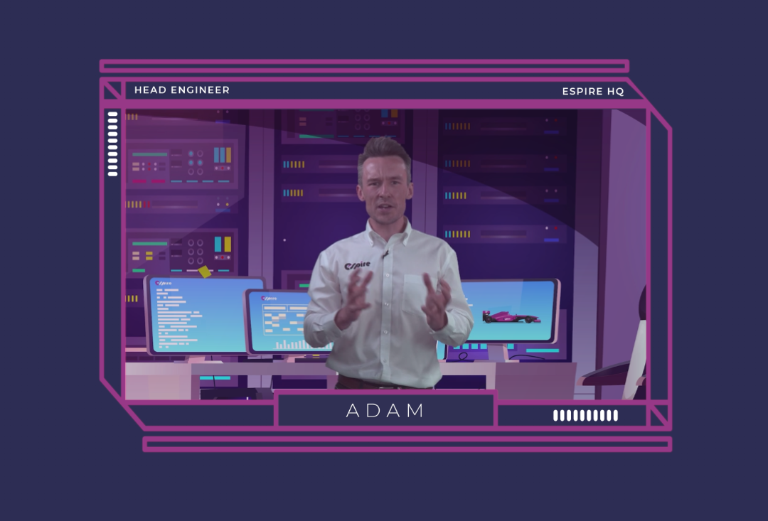Head Engineer Adam presenting at Espire HQ with computers and technology in the background.