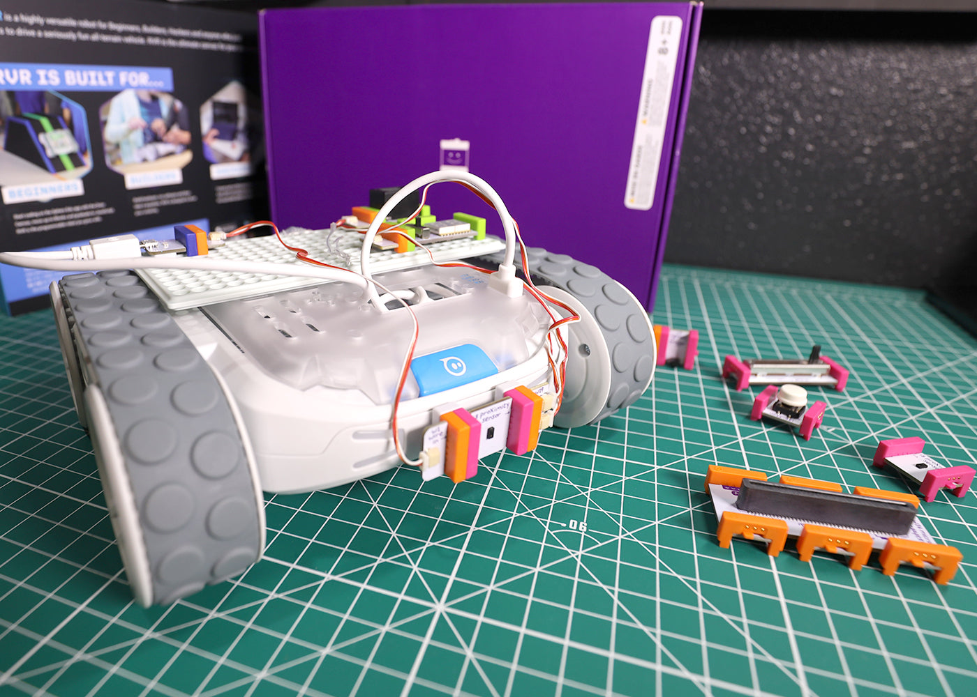 Sphero RVR robot with littleBits Topper Kit components on a green grid surface, showcasing creative invention potential.