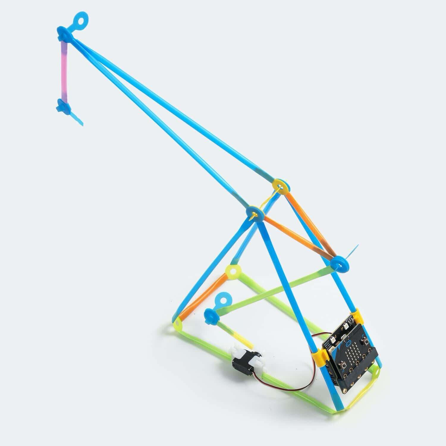 Robotic crane model using micro:bit and Strawbees construction pieces in colorful design.