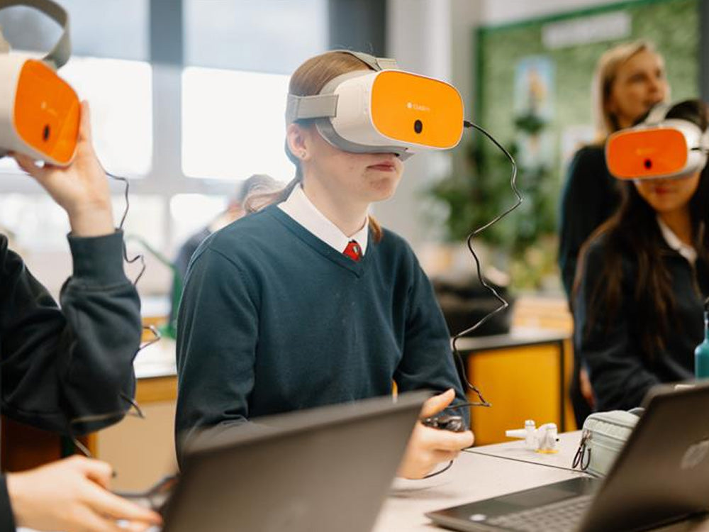 Students using virtual reality headsets in a classroom for immersive learning experiences.