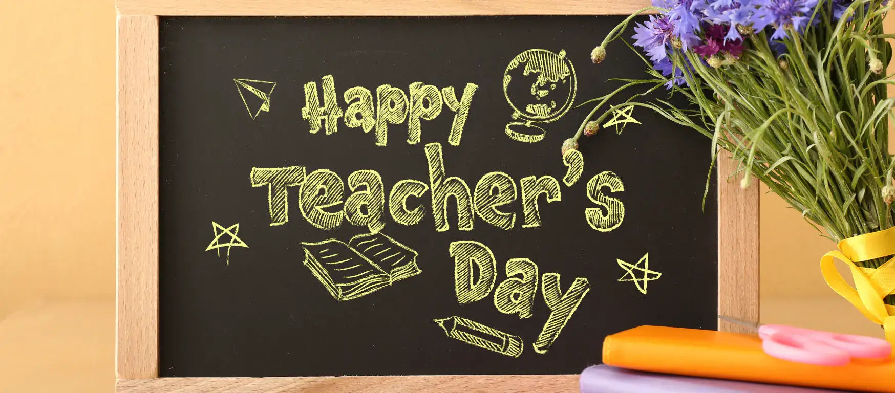 Chalkboard with 'Happy Teacher's Day' message and colorful flowers celebrating teachers.