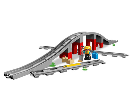 LEGO DUPLO Town Train Bridge set 10872 with tracks, tunnel, and builder figure, perfect for creative play.