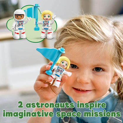 Child playing with LEGO® DUPLO astronauts promoting imaginative space missions and developmental skills.