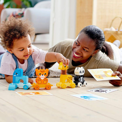 Child and parent playing with LEGO® DUPLO My First Animal Train Toy, enjoying animal-themed creative activity.