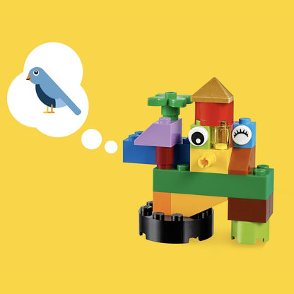 Colorful LEGO® Classic Basic Brick Set creation resembling a whimsical bird and tree against a yellow background.