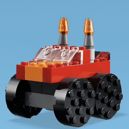 Colorful LEGO® Classic building toy vehicle with orange and black bricks and transparent elements, perfect for creative play.