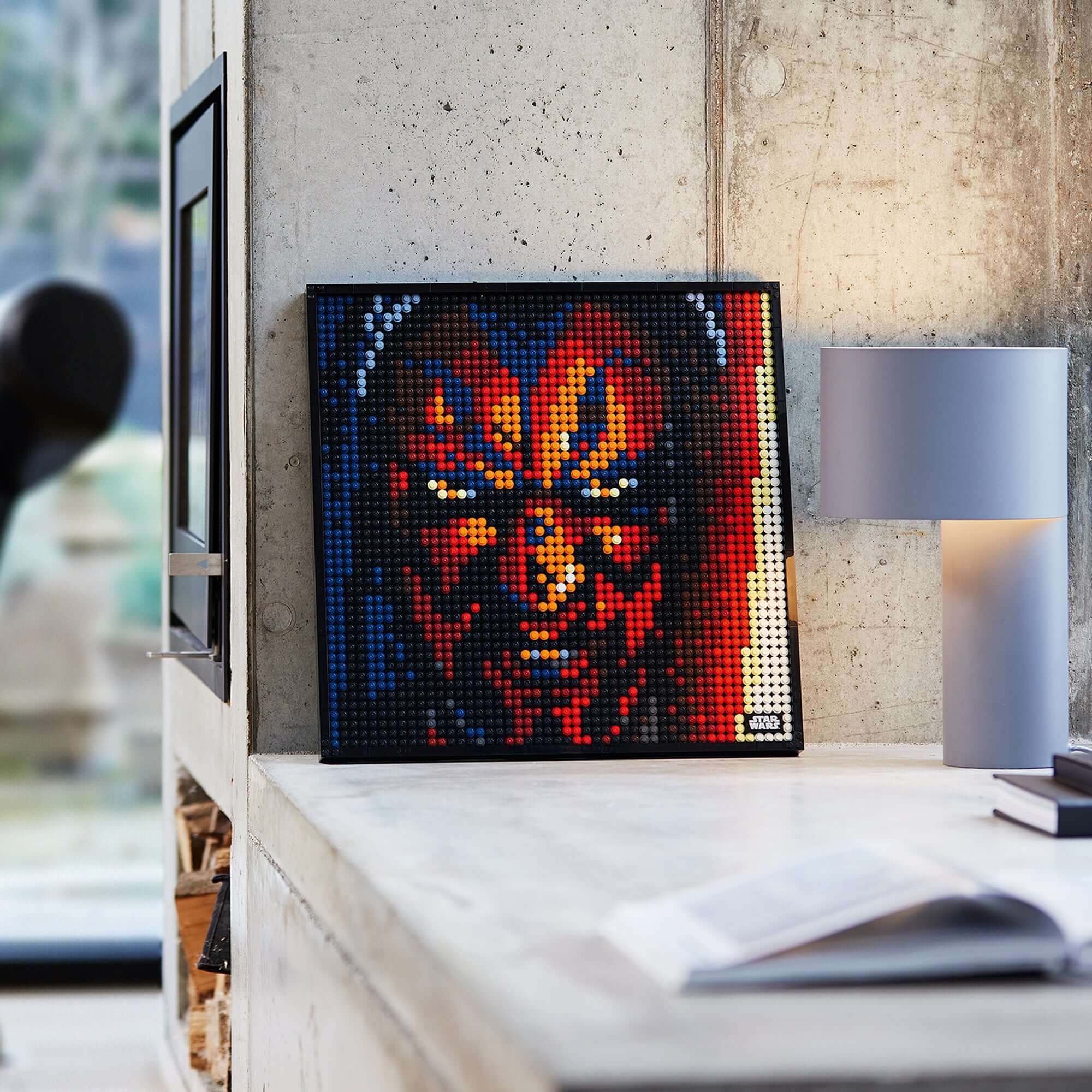 LEGO® Art Star Wars The Sith set displaying vibrant Darth Maul wall art on a modern interior table.