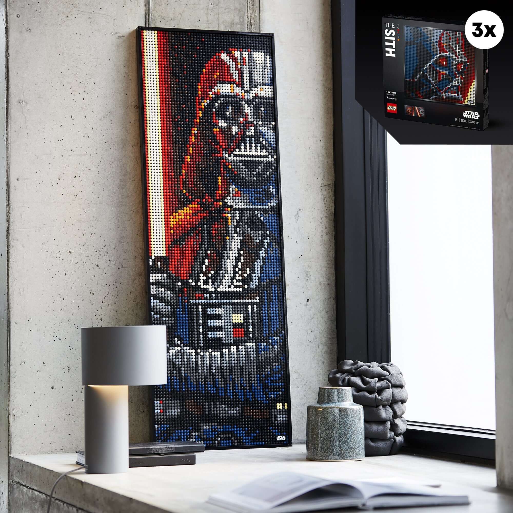 LEGO Art Star Wars The Sith building set displayed as wall art featuring Darth Vader, with a lamp beside it.
