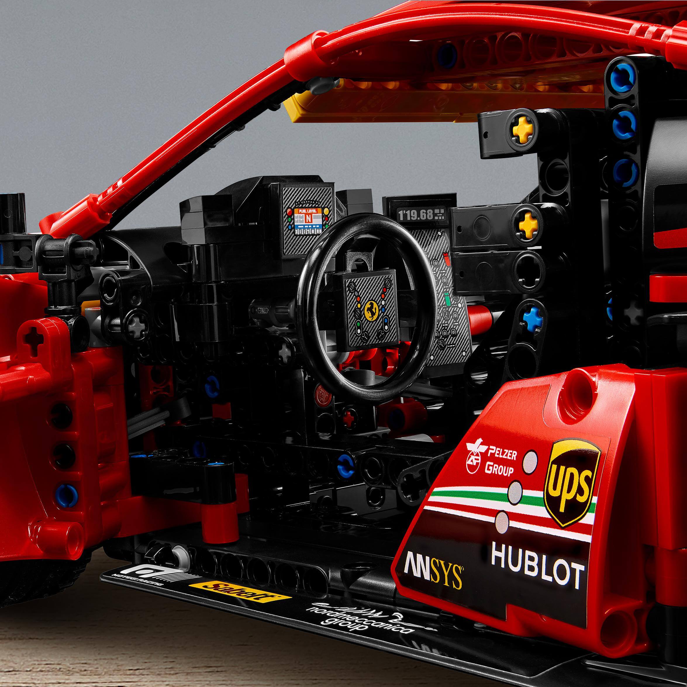 Interior view of LEGO Technic Ferrari 488 GTE model with detailed dashboard and racing elements.