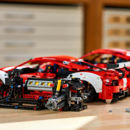 LEGO Technic Ferrari 488 GTE AF Corse #51 Set 42125 model on a table, highlighting intricate building details.