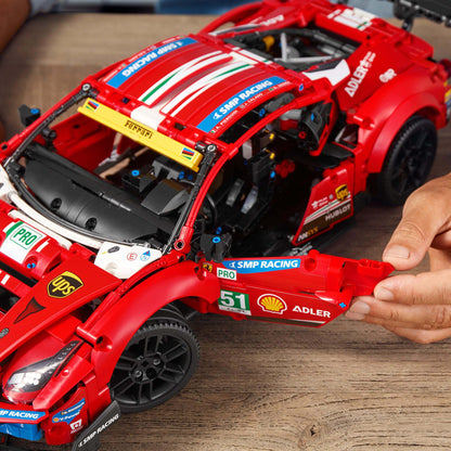 Detailed LEGO® Technic Ferrari 488 GTE model with open doors, showcasing intricate build and design.