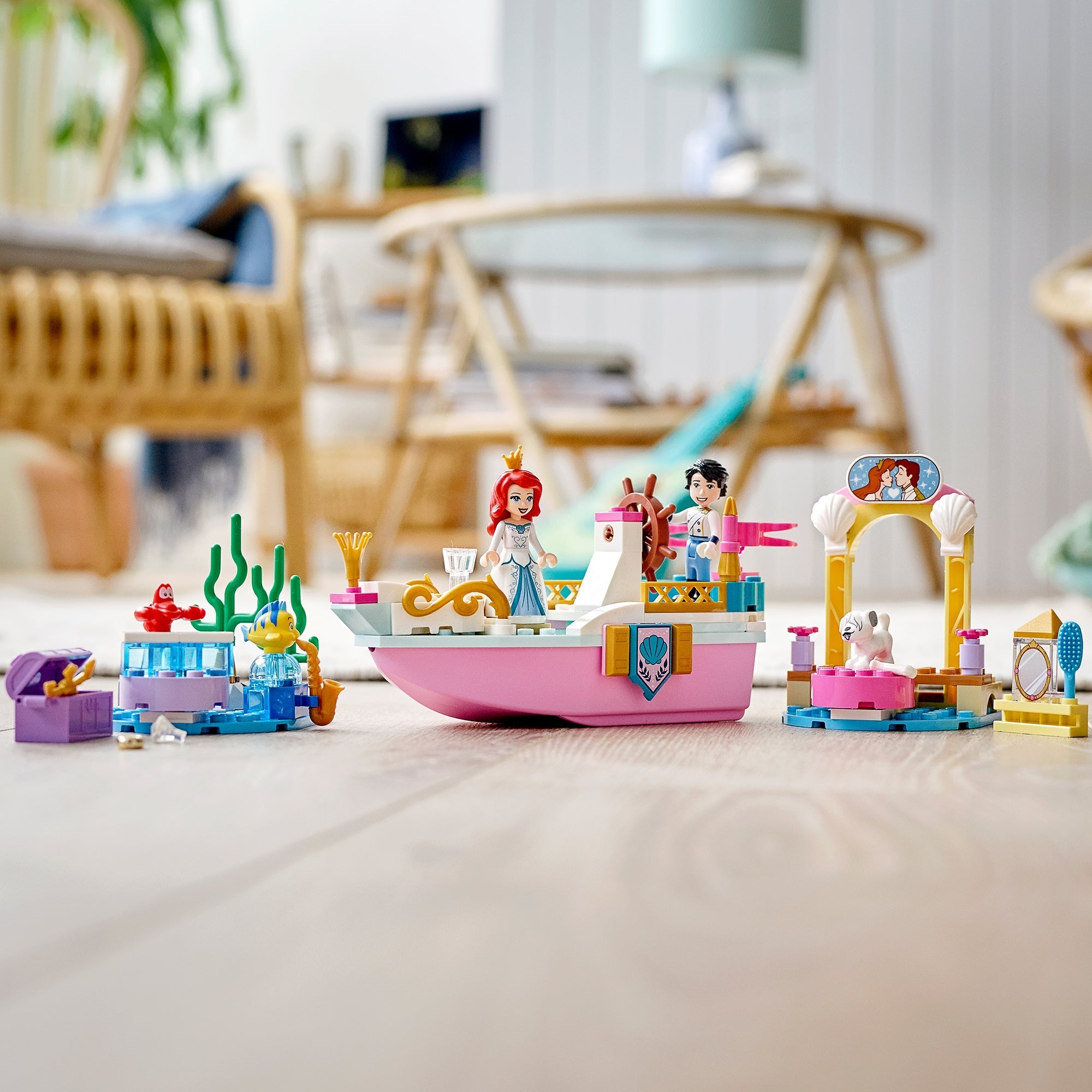 LEGO® Disney Ariel’s Celebration Boat Toy 43191 with minidolls, boat, and marine life in a vibrant play setting.