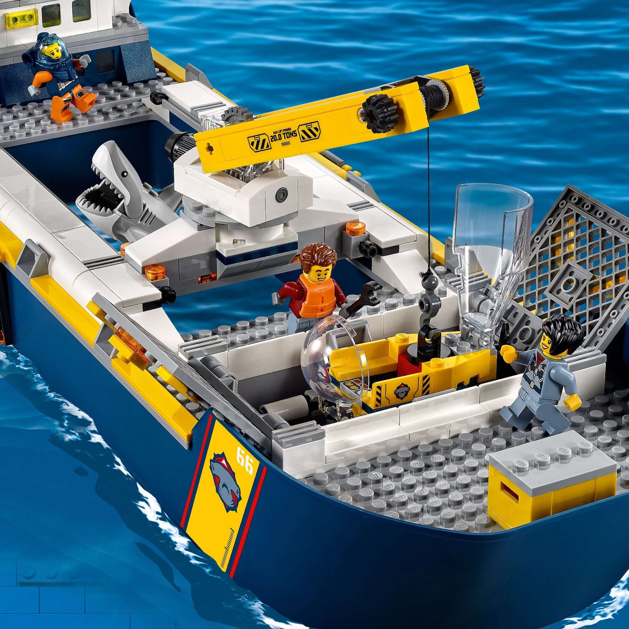 LEGO® City Ocean Exploration Ship Toy 60266 with mini-figures, crane, and shark in playful ocean setting.