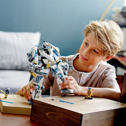 Child playing with LEGO® NINJAGO Zane’s Titan Mech toy 71738, showcasing creativity and fun in ninja adventures.