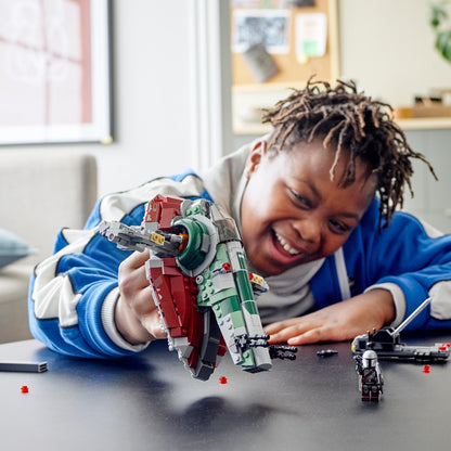 Child playing with LEGO Star Wars Boba Fett's Starship Set 75312, enjoying imaginative play.