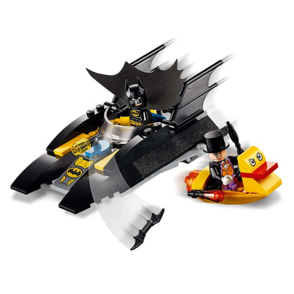 LEGO® DC Batman Batboat set featuring Batman and The Penguin in a playful chase on the water.