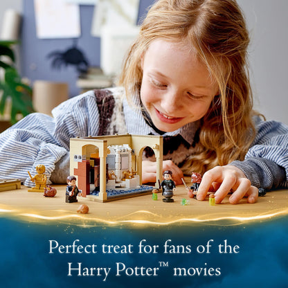 Child playing with LEGO® Harry Potter Hogwarts Potion Mistake Set 76386, enjoying magical adventures in Hogwarts.