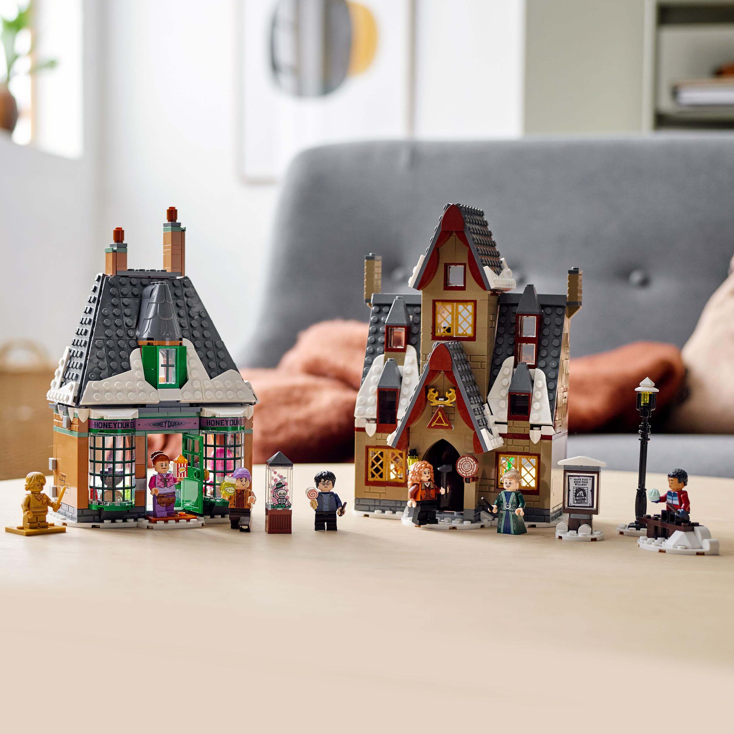 LEGO Harry Potter Hogsmeade Village Visit Set 76388 with two buildings and mini-figures in a cozy play setting.