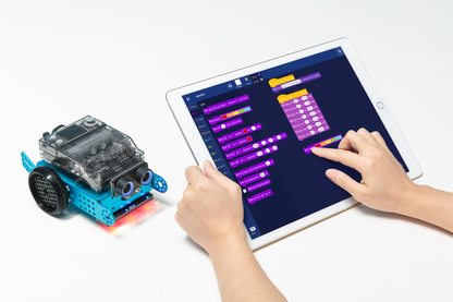 Makeblock mBot 2 educational robot interacting with a tablet for coding and programming activities.