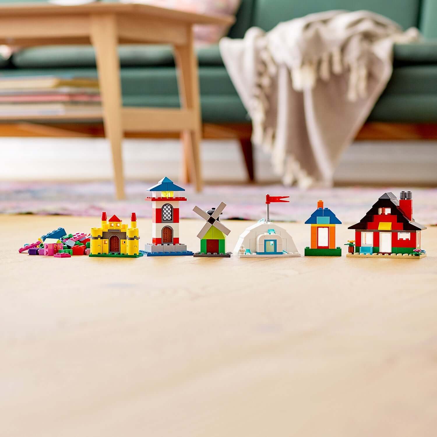 Colorful LEGO® Classic 4+ Bricks and Houses Set 11008 with various imaginative house designs on display.