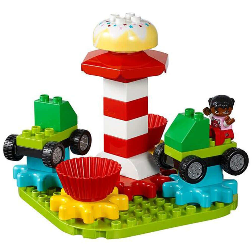 LEGO® Education STEAM Park 45024 with colorful carousel, vehicles, and cheerful character for creative play.