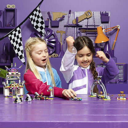 Two children enjoying the LEGO® FRIENDS The Big Race Day playset, celebrating go-kart racing fun in Heartlake City.