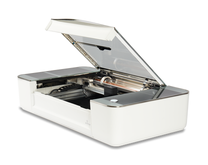 Glowforge Plus laser cutter with lid open, showcasing upgraded components and design.