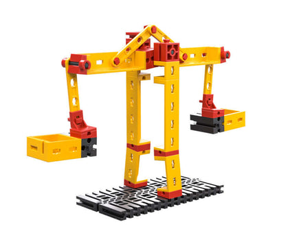 Colorful plastic crane model showcasing simple machines for teaching physics to primary school students.