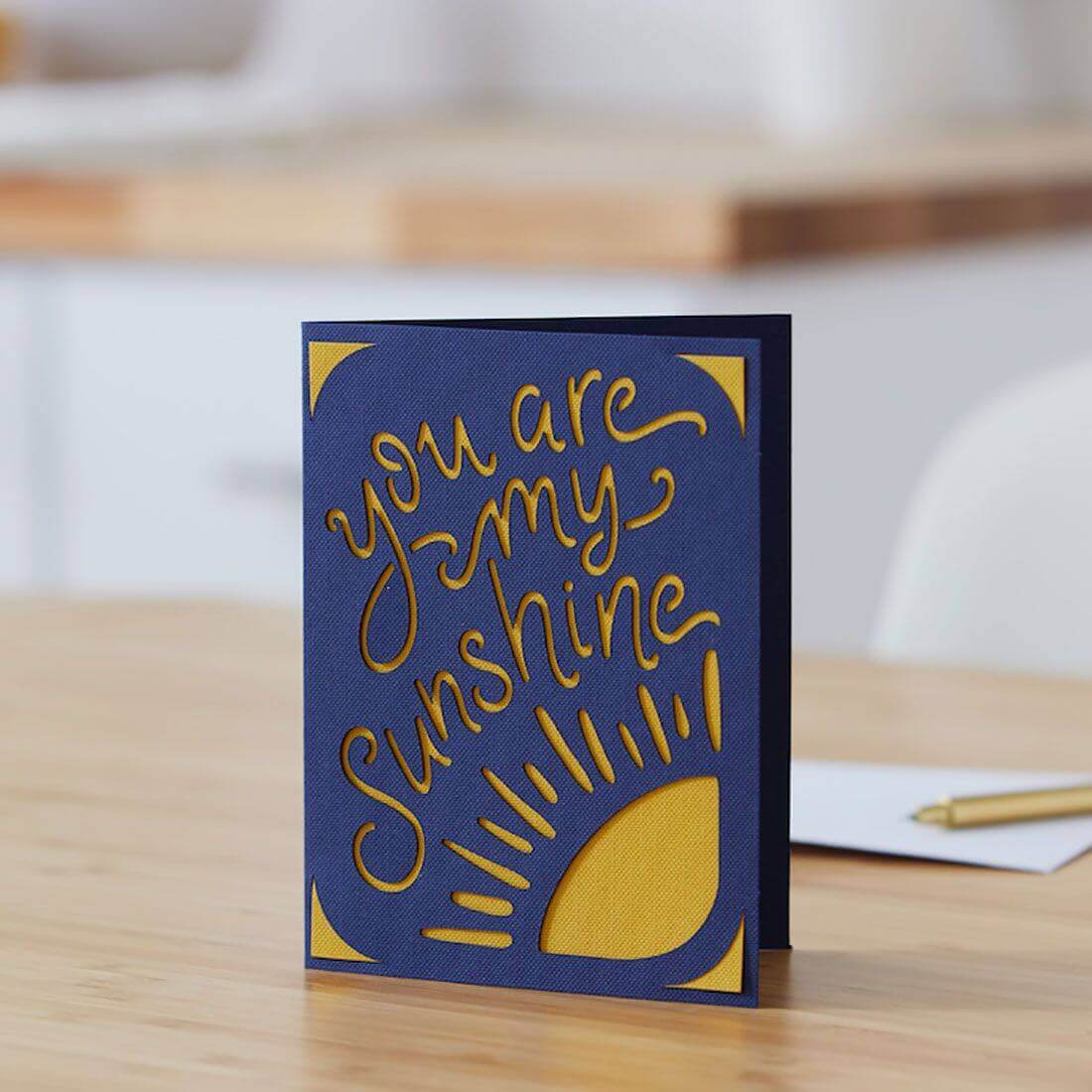 Personalized greeting card with yellow sun design and script 'you are my Sunshine', made with Cricut Joy insert cards.