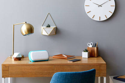 Elegant workspace featuring Cricut Joy, stylish lamp, and organized desk for DIY projects.