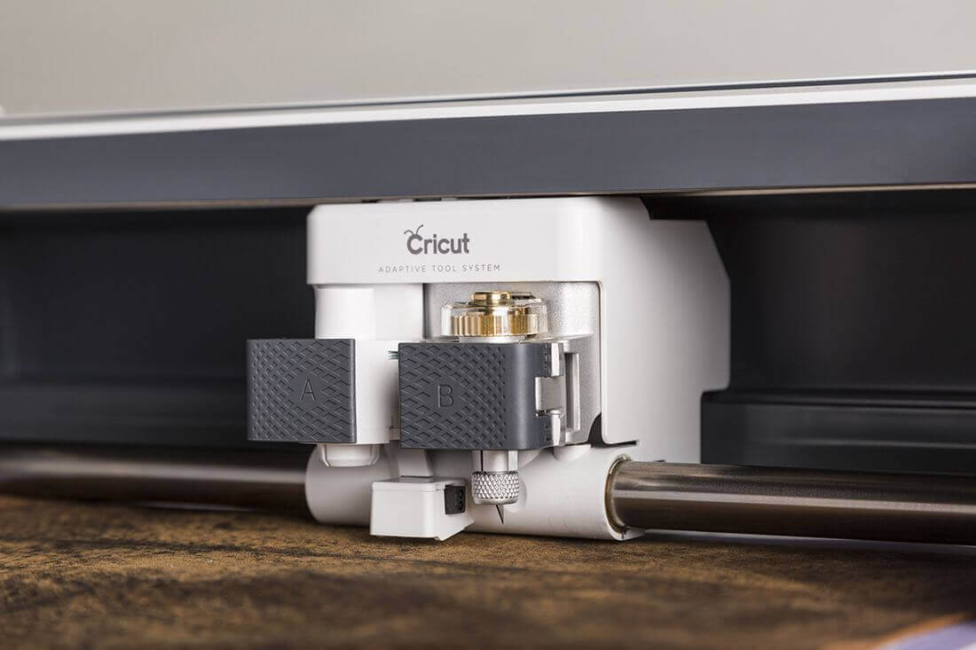 Cricut Maker knife blade drive housing close-up for precise cutting of thick materials.
