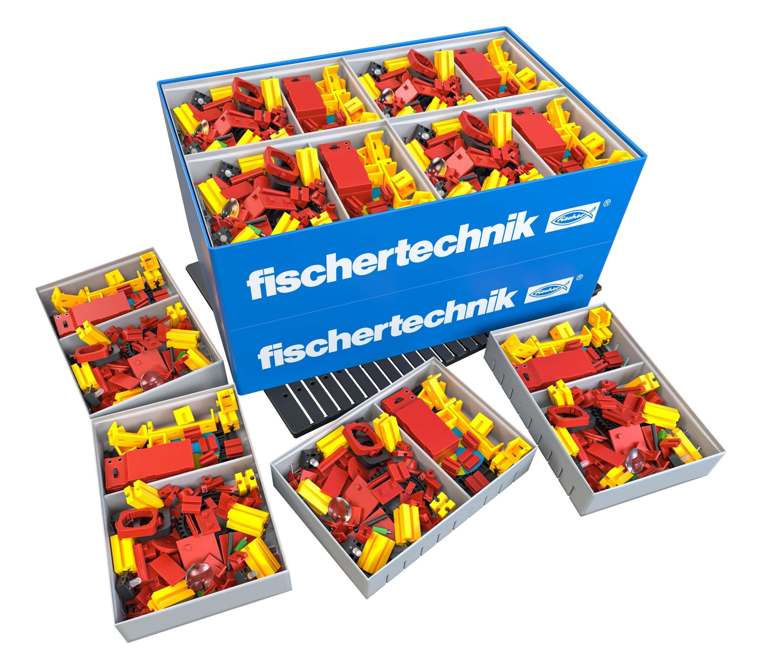 Colorful fischertechnik building set in storage boxes, ideal for teaching optics concepts to primary school students.