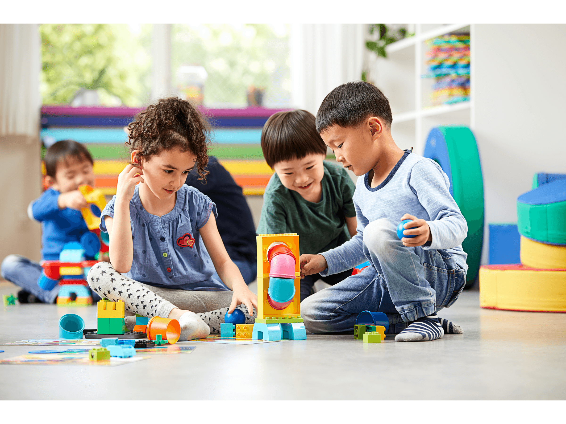 Children engaging in imaginative play with colorful LEGO® Education Tubes, building creative models and developing skills.