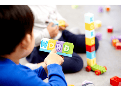 Child playing with colorful LEGO® bricks, spelling the word 'WORD' while learning the alphabet with LEGO® Education Letters.