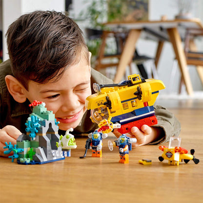 Child enjoying LEGO City Ocean Exploration Submarine set 60264 with colorful underwater scene and characters.