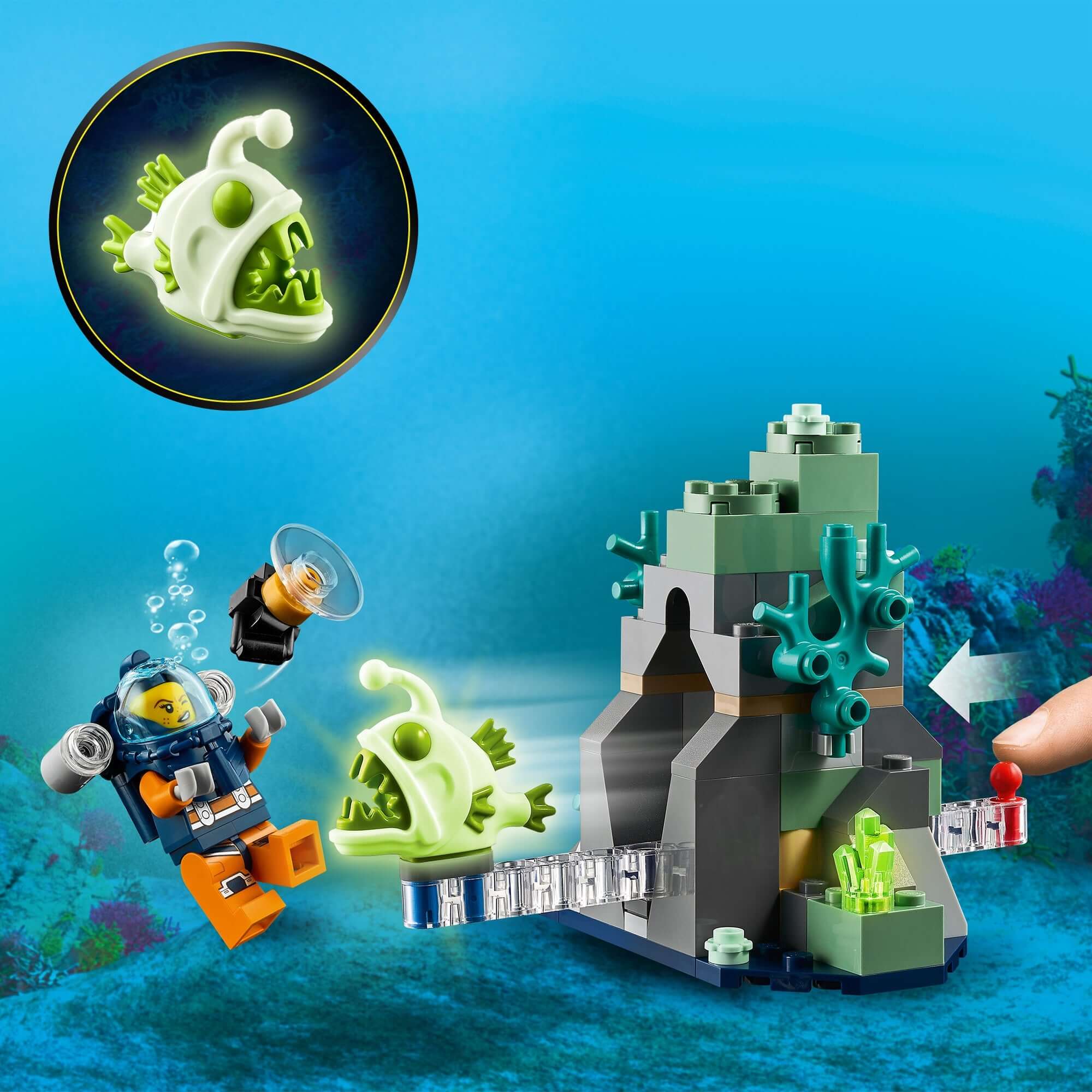 LEGO® City Ocean Exploration Submarine set featuring diver and glowing fish at an underwater rock formation.
