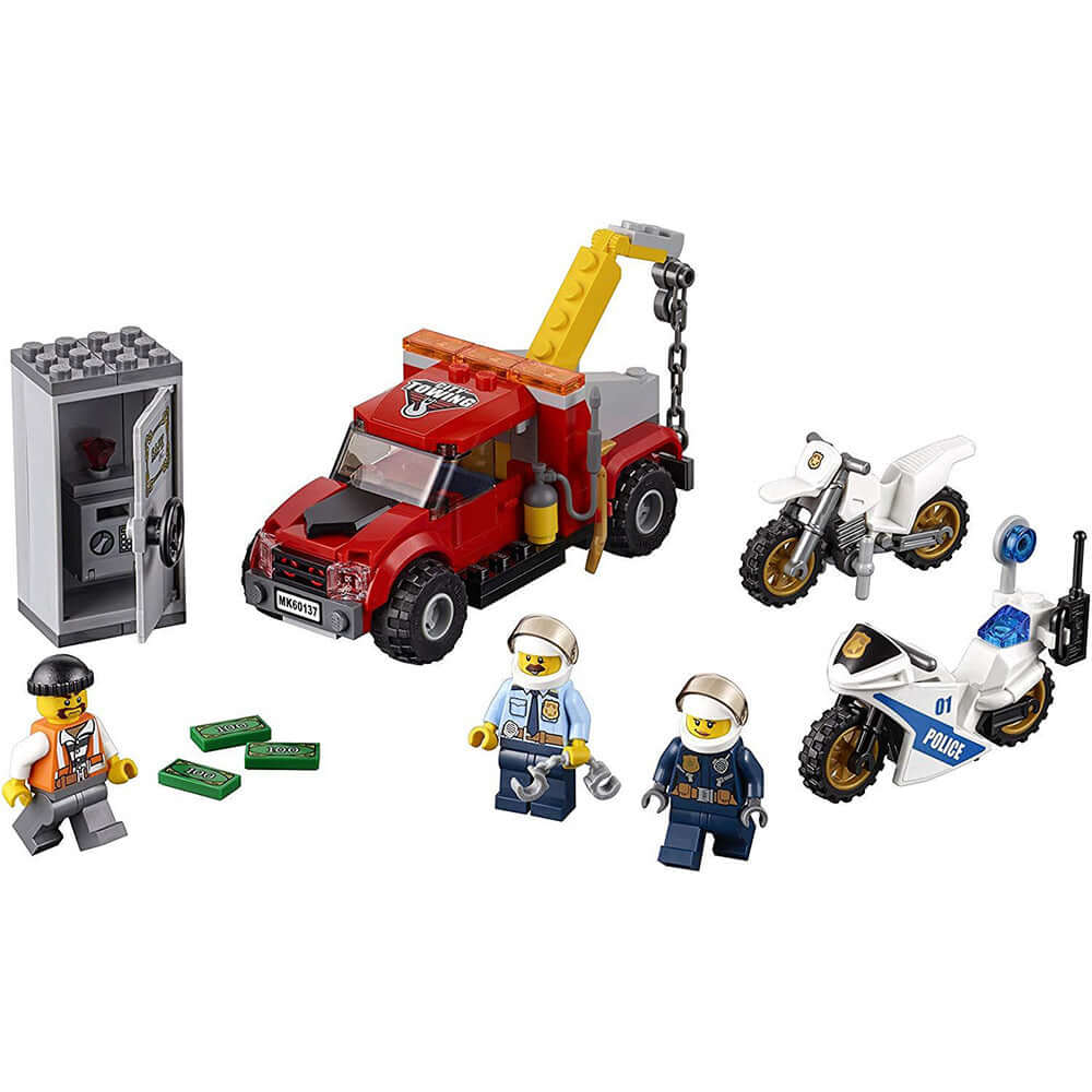 LEGO City police Tow Truck Trouble set 60137 with chase scene, tow truck, police bikes, safe, and minifigures.