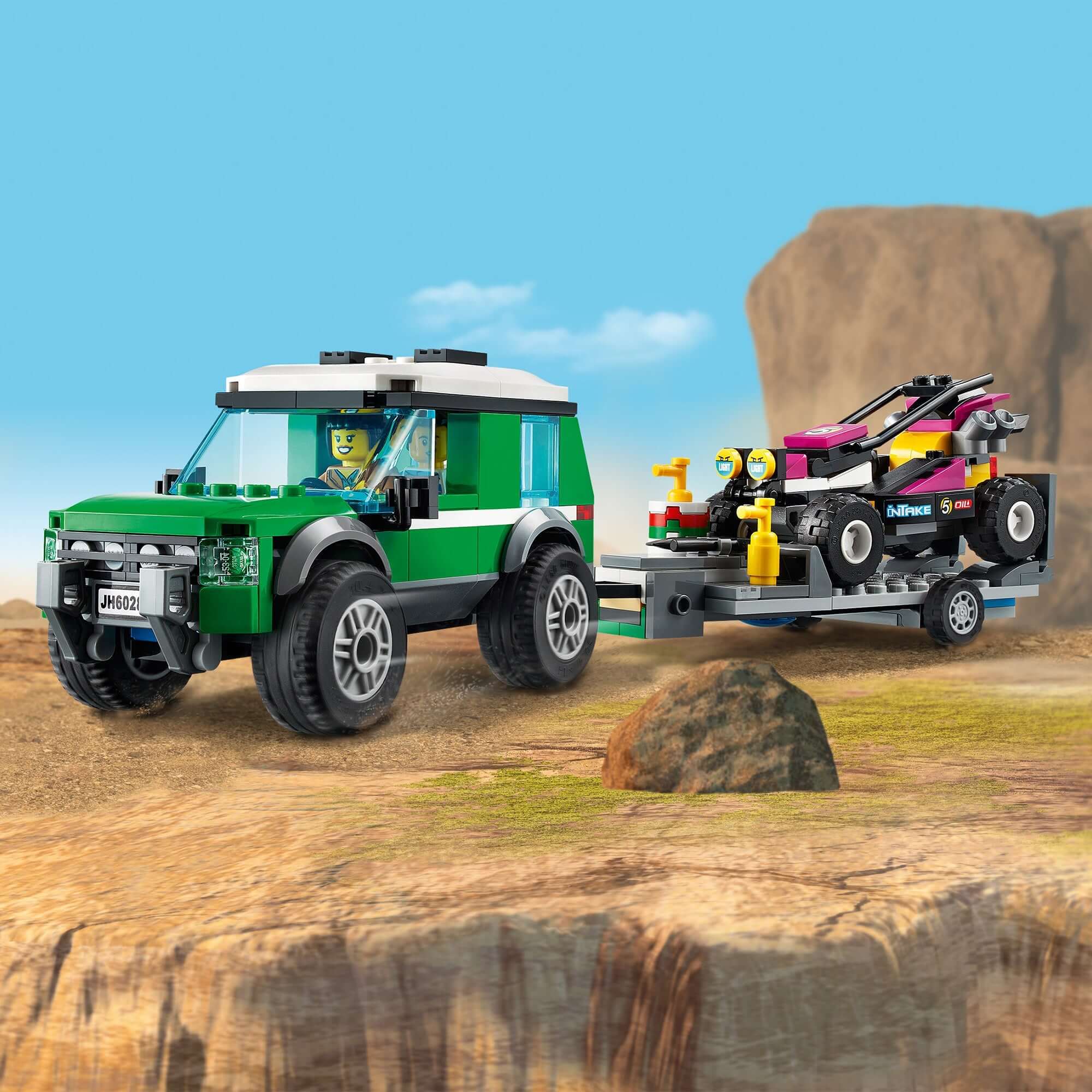 LEGO® City Race Buggy Transporter Toy Truck 60288 with SUV and Baja race buggy on a rocky terrain.