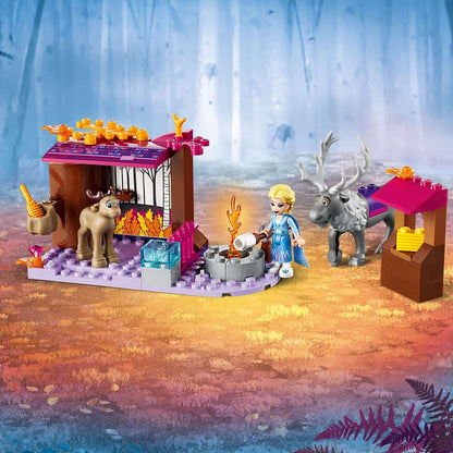 LEGO Disney Frozen 2 Elsa's Wagon Adventure set with Elsa, Sven, and a campfire scene in a whimsical forest.