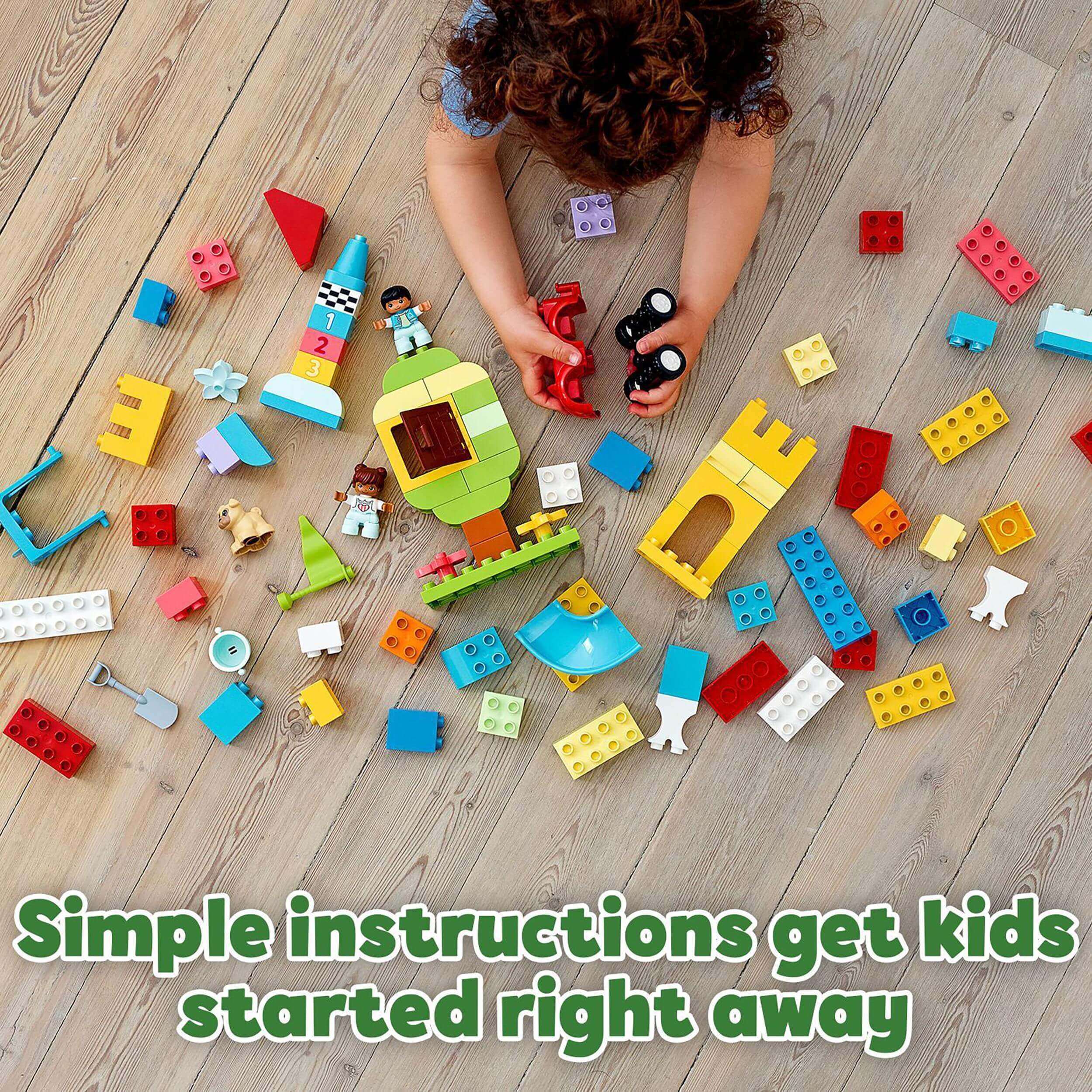 Child playing with LEGO® DUPLO bricks, featuring a colorful assortment and simple assembly instructions.